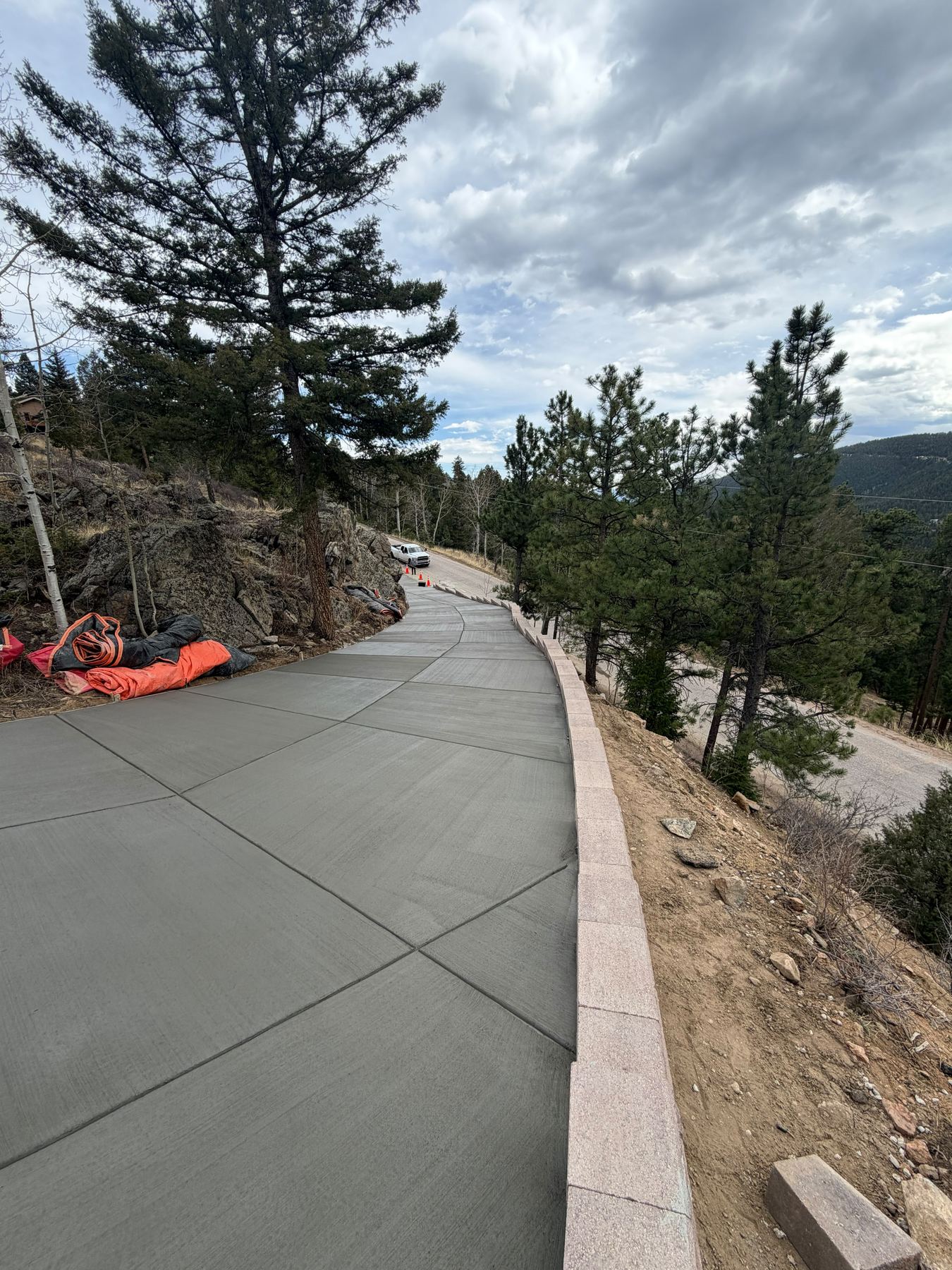 Concrete driveway with mountain retaining wall, Conifer, CO
