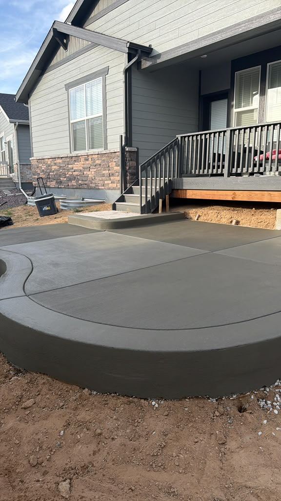 Concrete patio with curved steps to deck, Denver Metro, CO