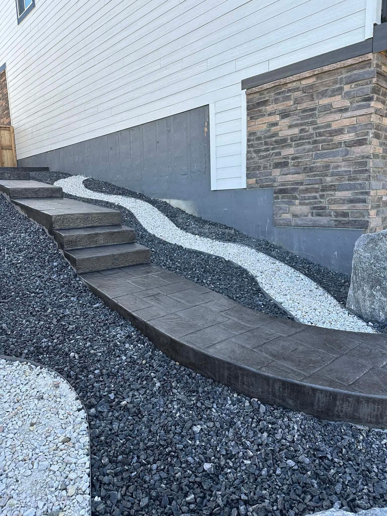 Concrete steps with drainage rock landscaping, Denver Metro, CO